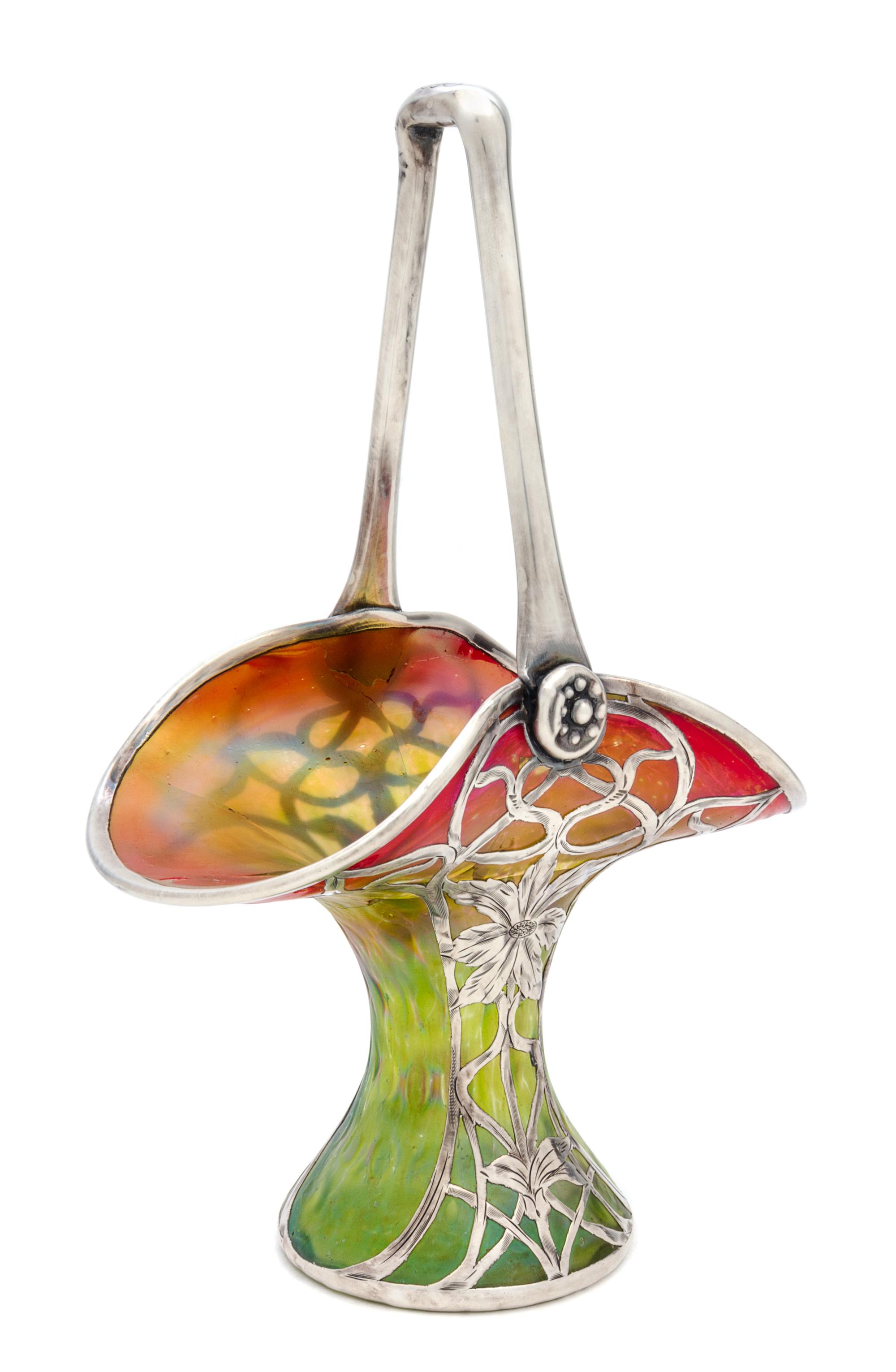 An Iridescent Glass Silver Overlay Basket, manner of Loetz Height 10 inches.