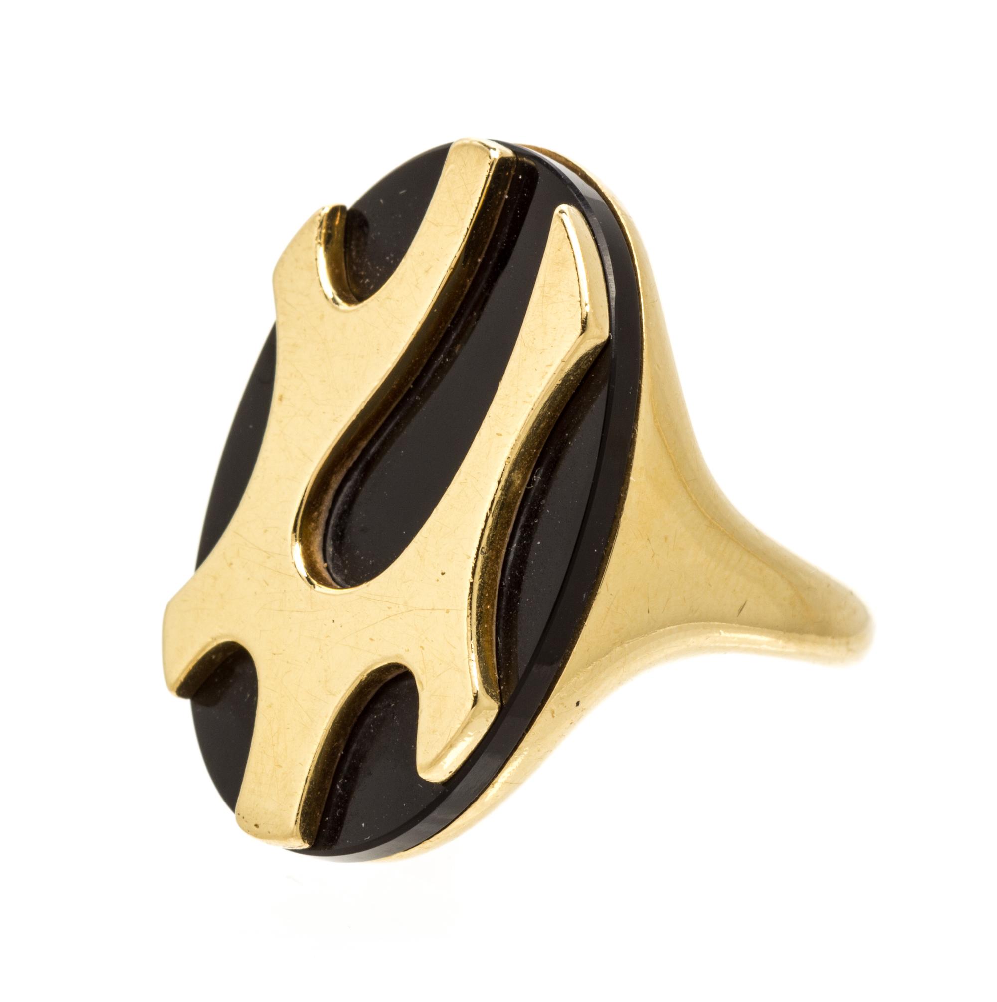 An 18 Karat Yellow Gold and Onyx Ring, 9.00 dwts.