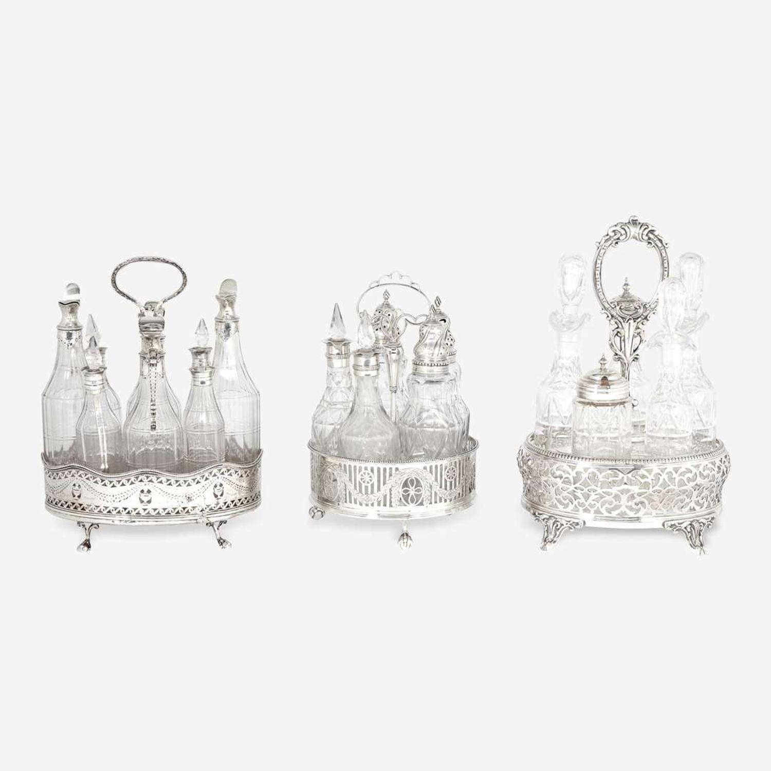 A group of three George III / Victorian sterling silver, silver plate, and glass cruet sets Various makers, late 18th / 19th century
