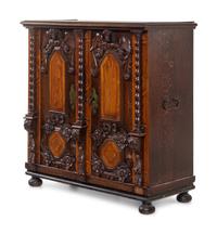 An Italian Baroque Carved Walnut and Oak Cabinet
