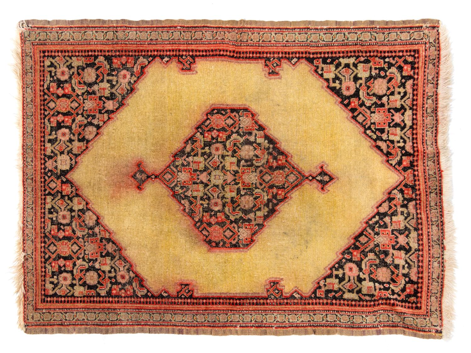 A Persian Wool Rug 2 feet 8 inches x 2 feet.