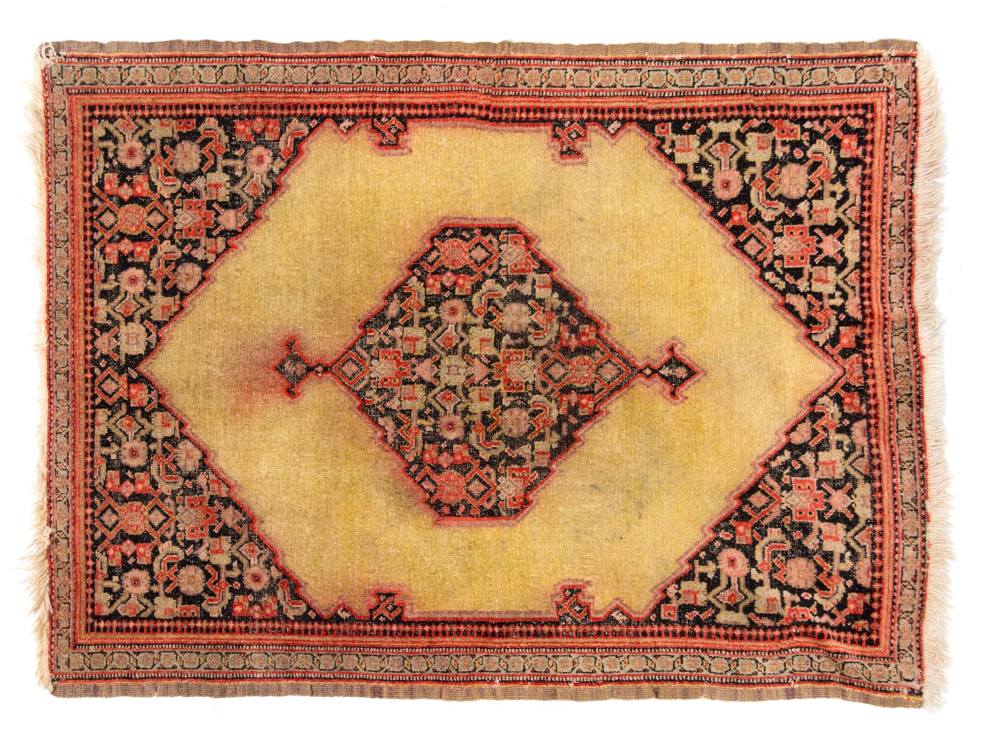 A Persian Wool Rug 2 feet 8 inches x 2 feet.