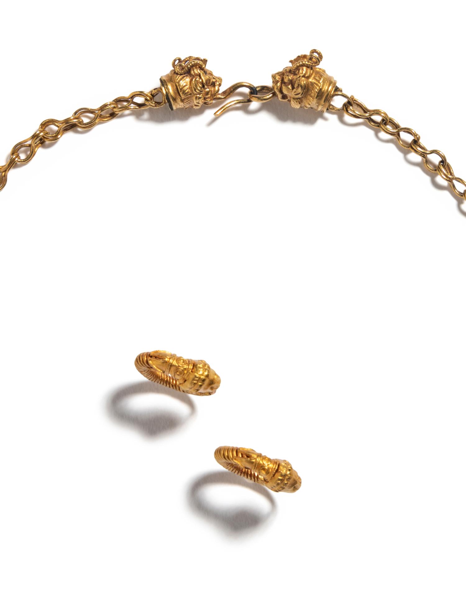 A Hellenistic Gold Necklace with a Pair of Hoop Earrings each with Lion-Head Terminals