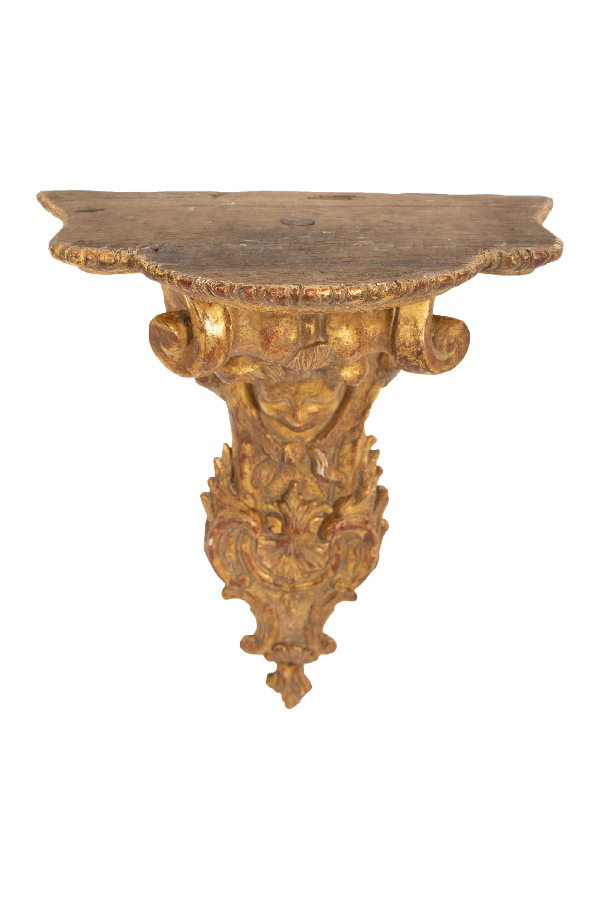 A Pair of Tin-Glazed Earthenware Wall Brackets, and Two Giltwood Wall Brackets