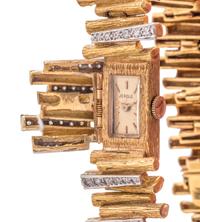 18K YELLOW GOLD AND DIAMOND SURPRISE WRISTWATCH