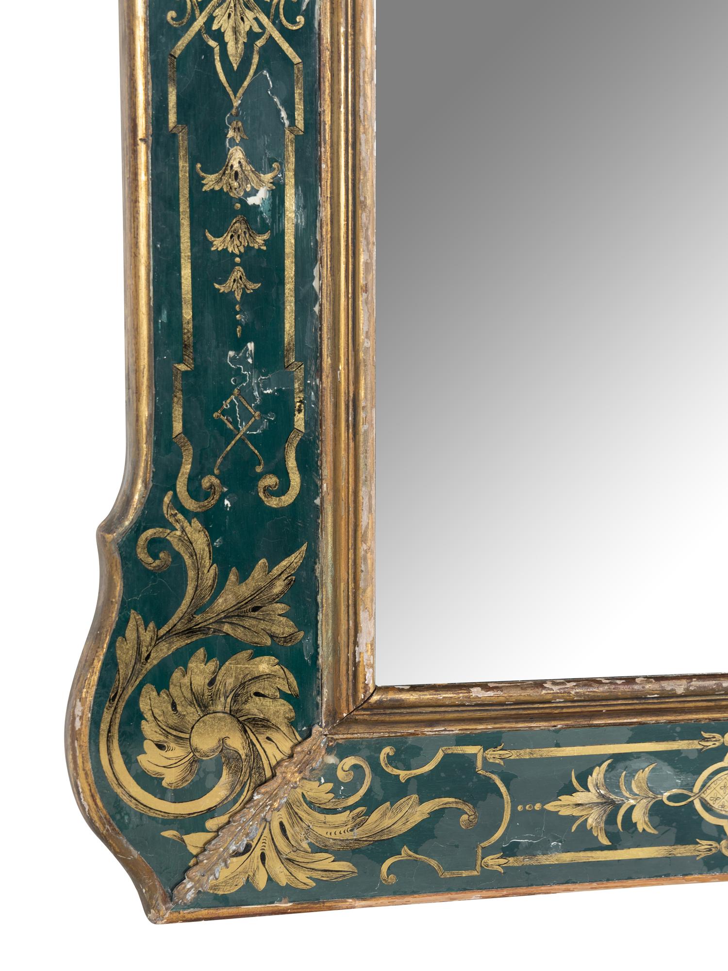 A Baroque Style Reverse Painted Glass and Giltwood Mirror