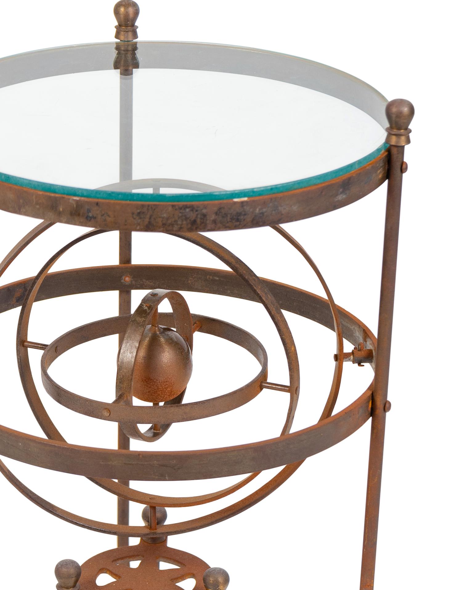 A Wrought Iron Glass-Top Side Table with a Gimbal Stretcher