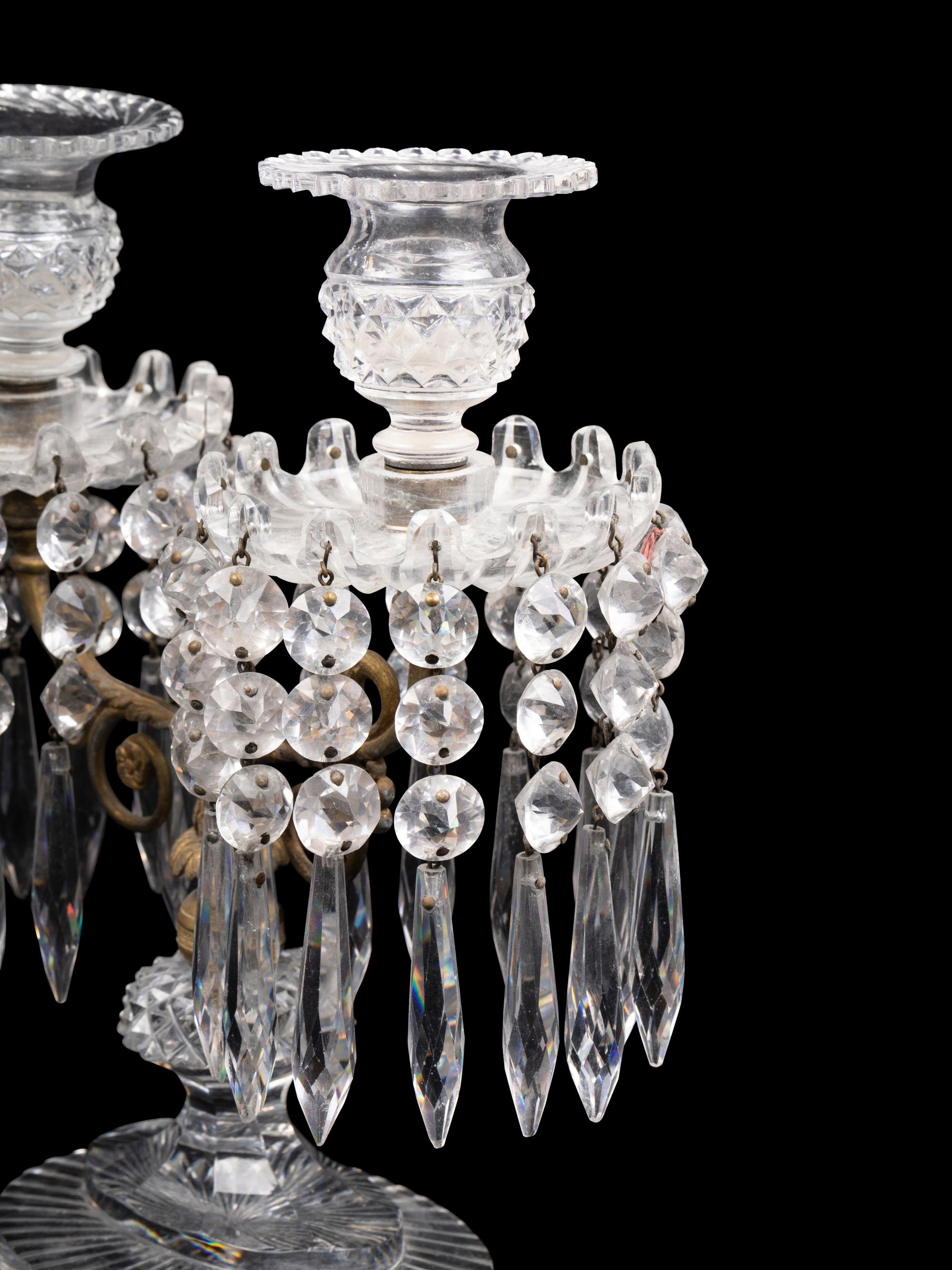 A Pair of Continental Gilt Metal and Cut Glass Two-Light Candelabra