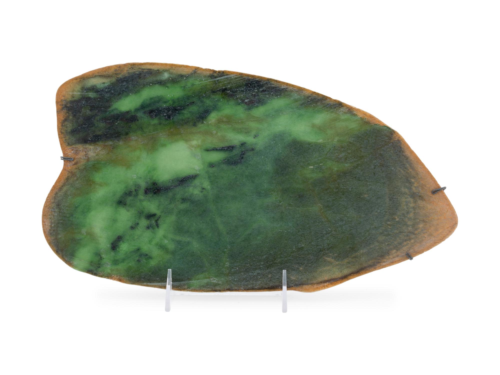 A Large Chinese Mottled Green Jade Plaque