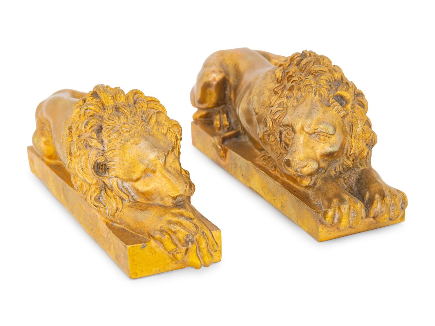 A Pair of Continental Bronze Recumbent Lions