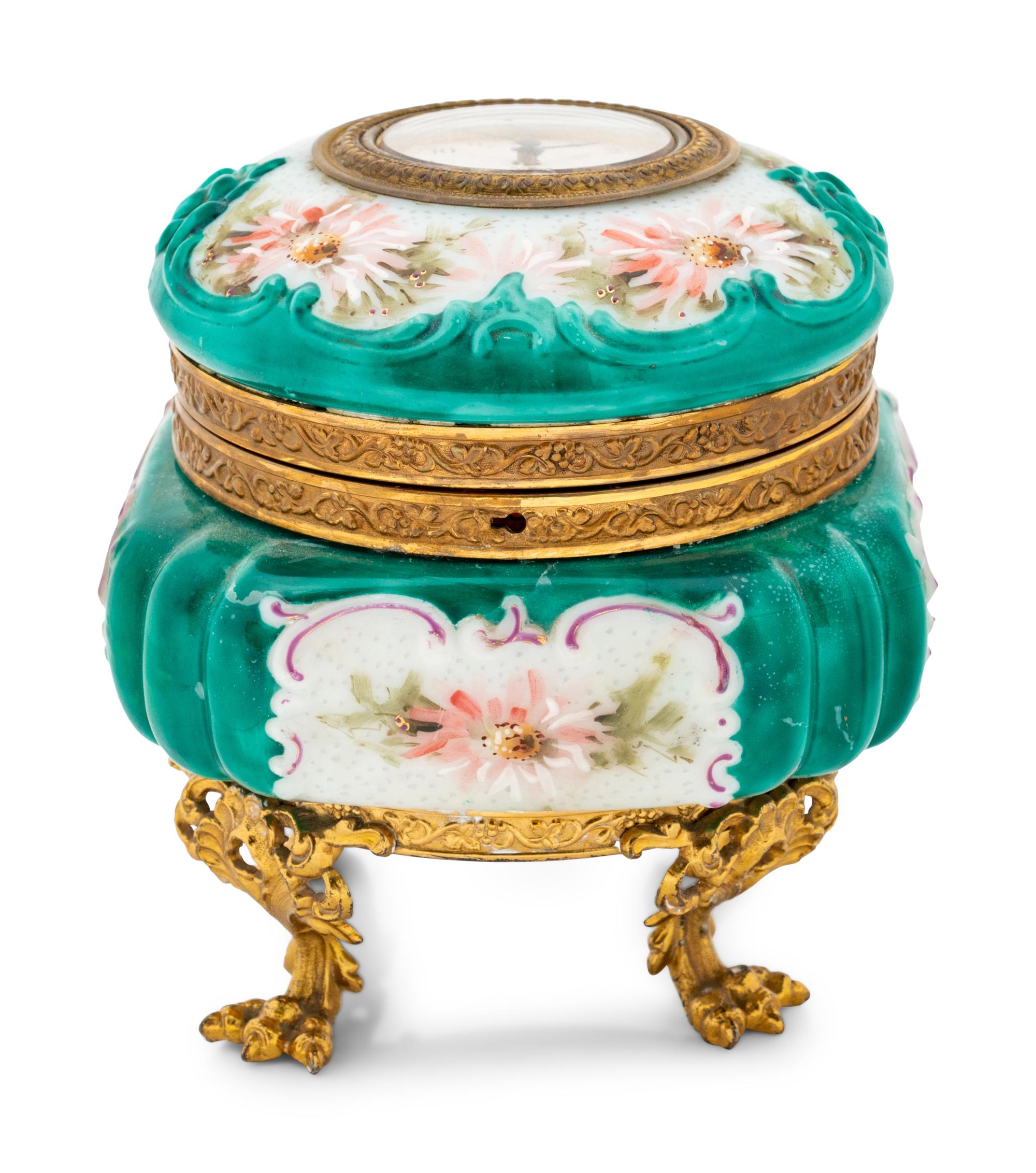 A Wavecrest Glass and Gilt Metal Footed Jewel Box with Clock