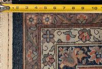 A Romanian Wool Rug of a Farahan Sarouk Design