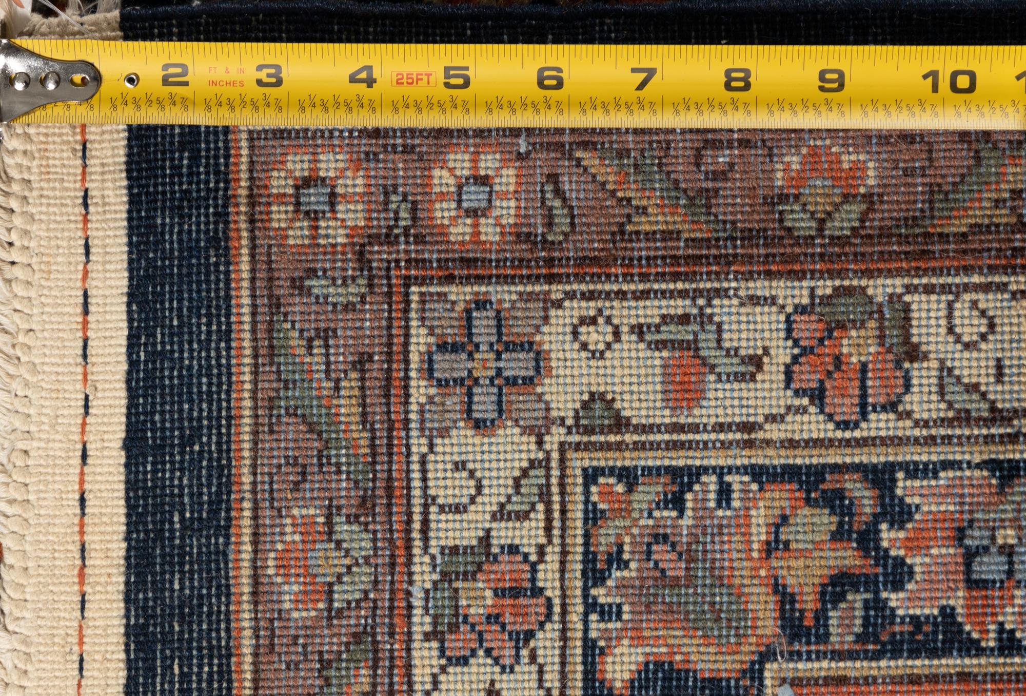 A Romanian Wool Rug of a Farahan Sarouk Design