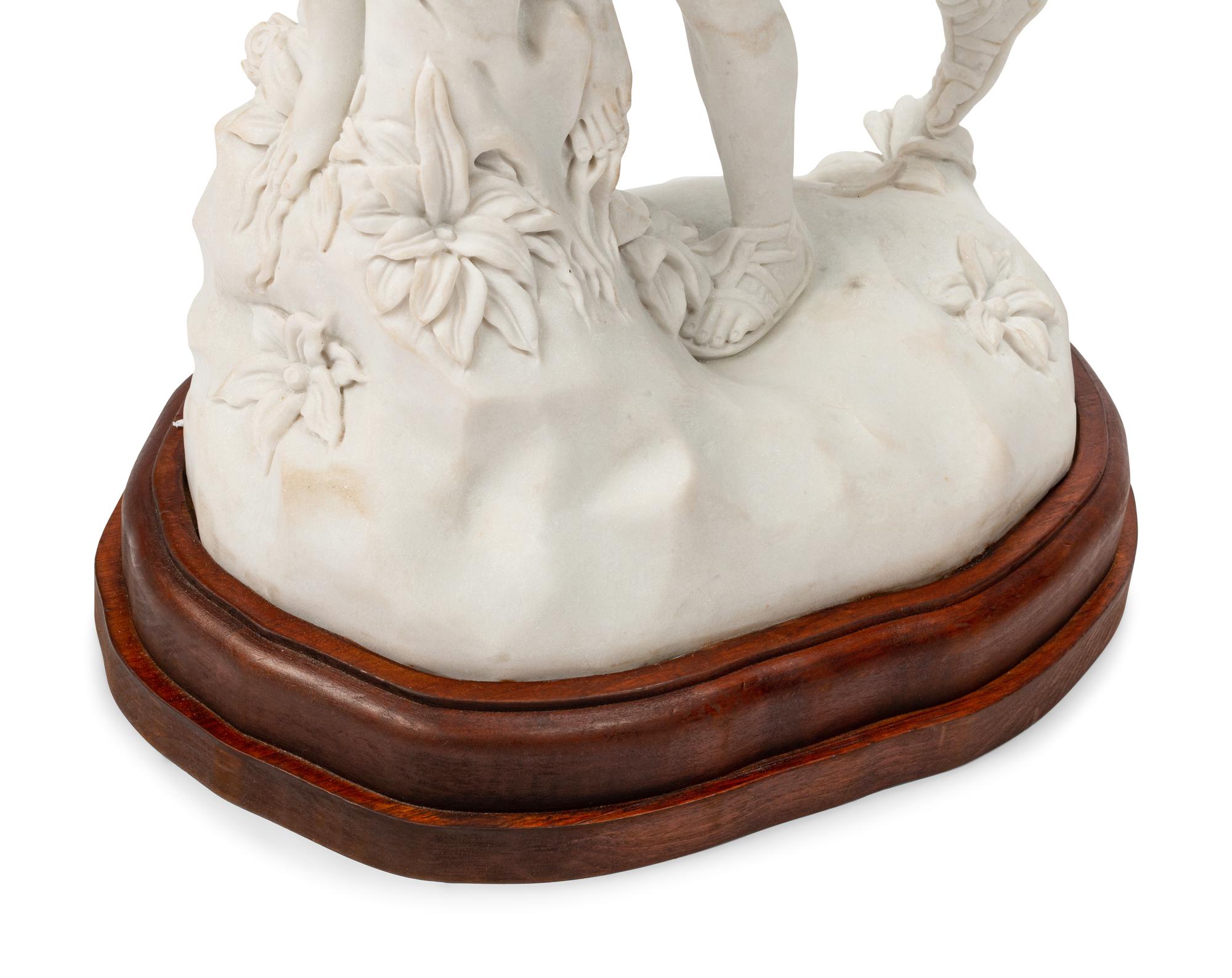 A Continental Marble Figural Group on a Wood Base