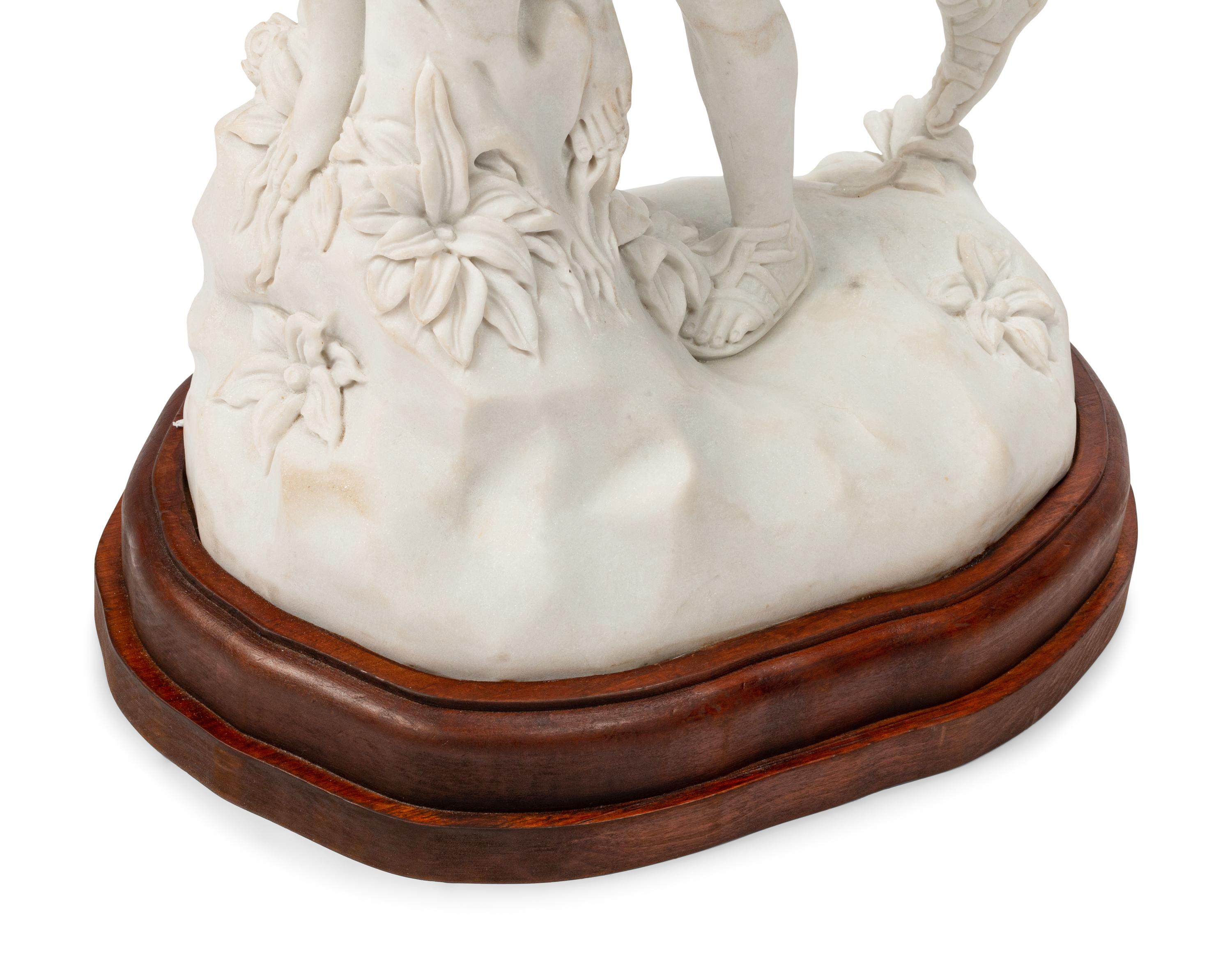 A Continental Marble Figural Group on a Wood Base