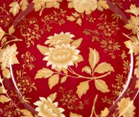 A Set of Twelve Wedgwood Porcelain Tonquin Rub y Dinner Plates