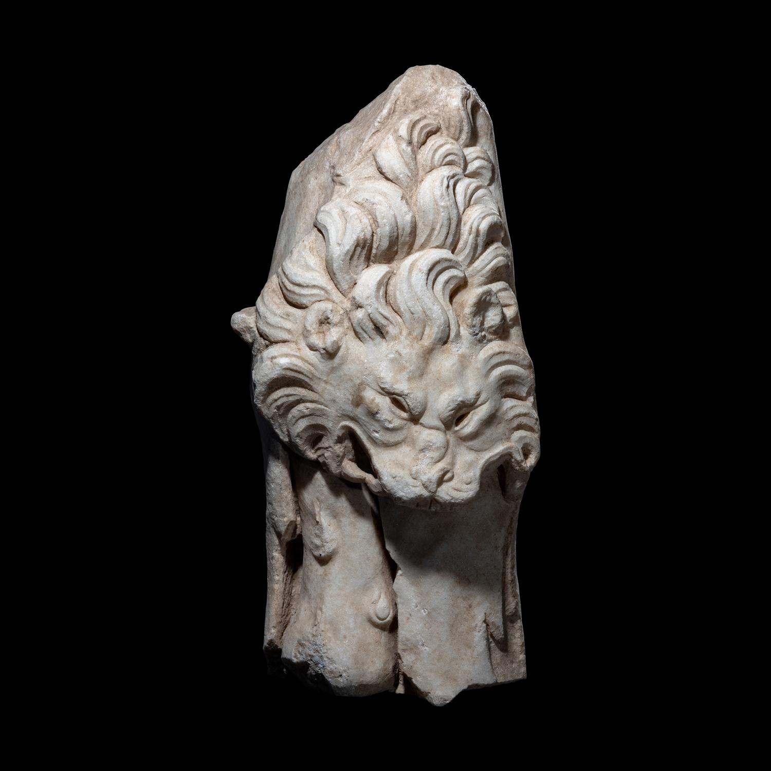 A Roman Marble Support in the form of the Nemean Lion Skin and Club of Hercules