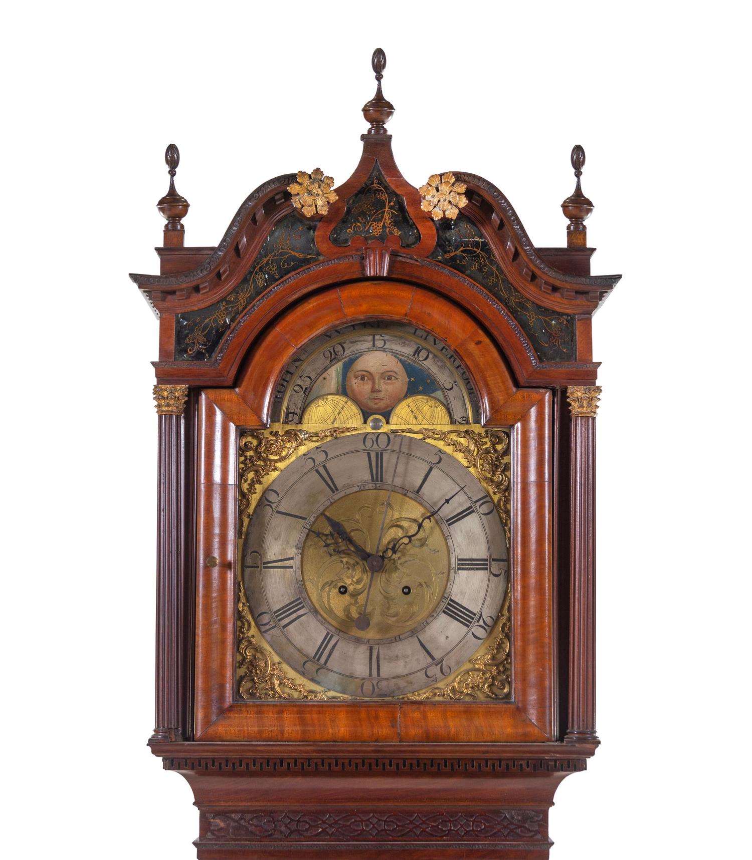 A George III Carved and Figured Mahogany Tall Case Clock