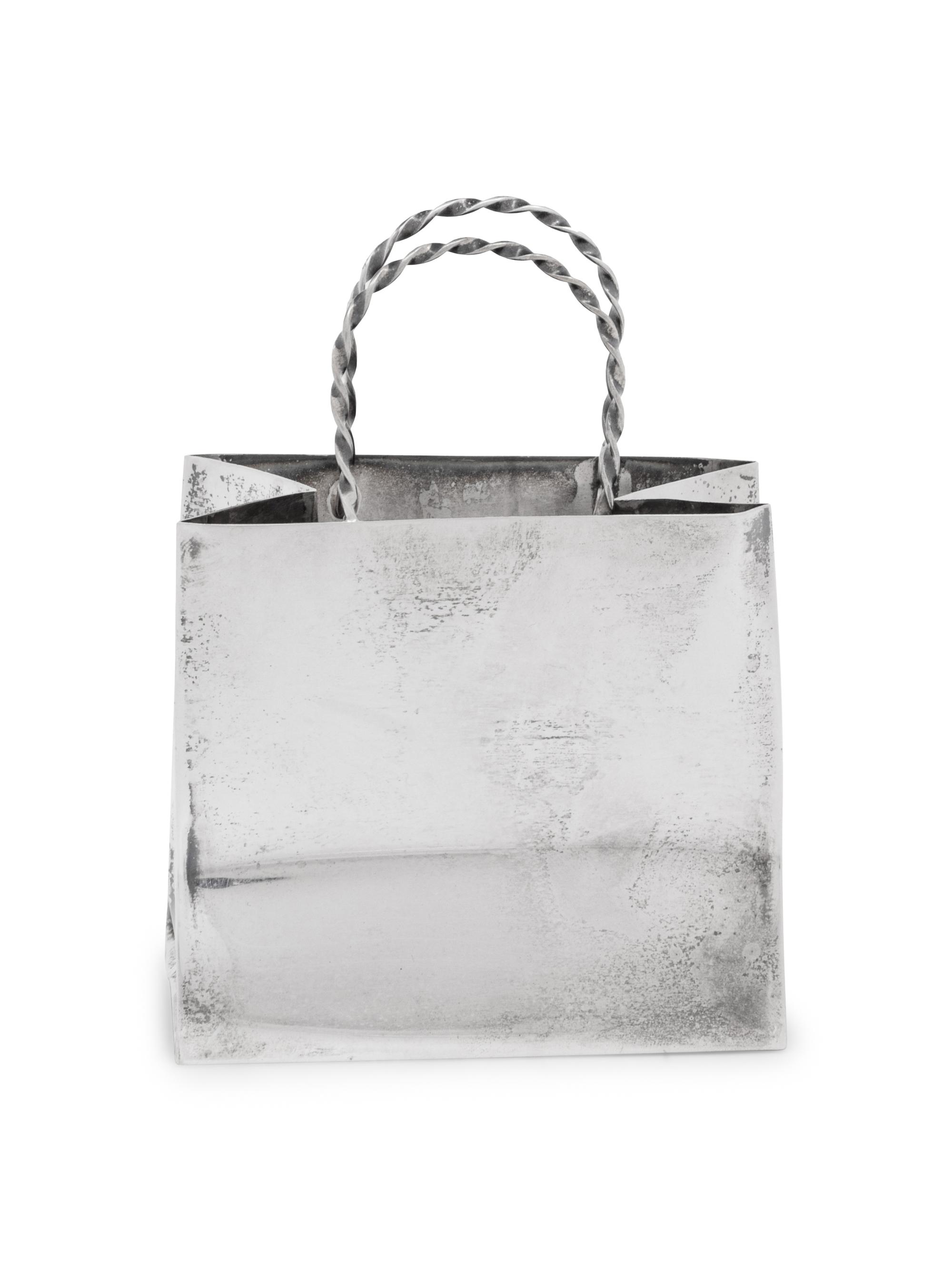 A Cartier Silver Table Article