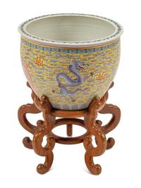 A Chinese Porcelain Jardinière on a Wood Stand