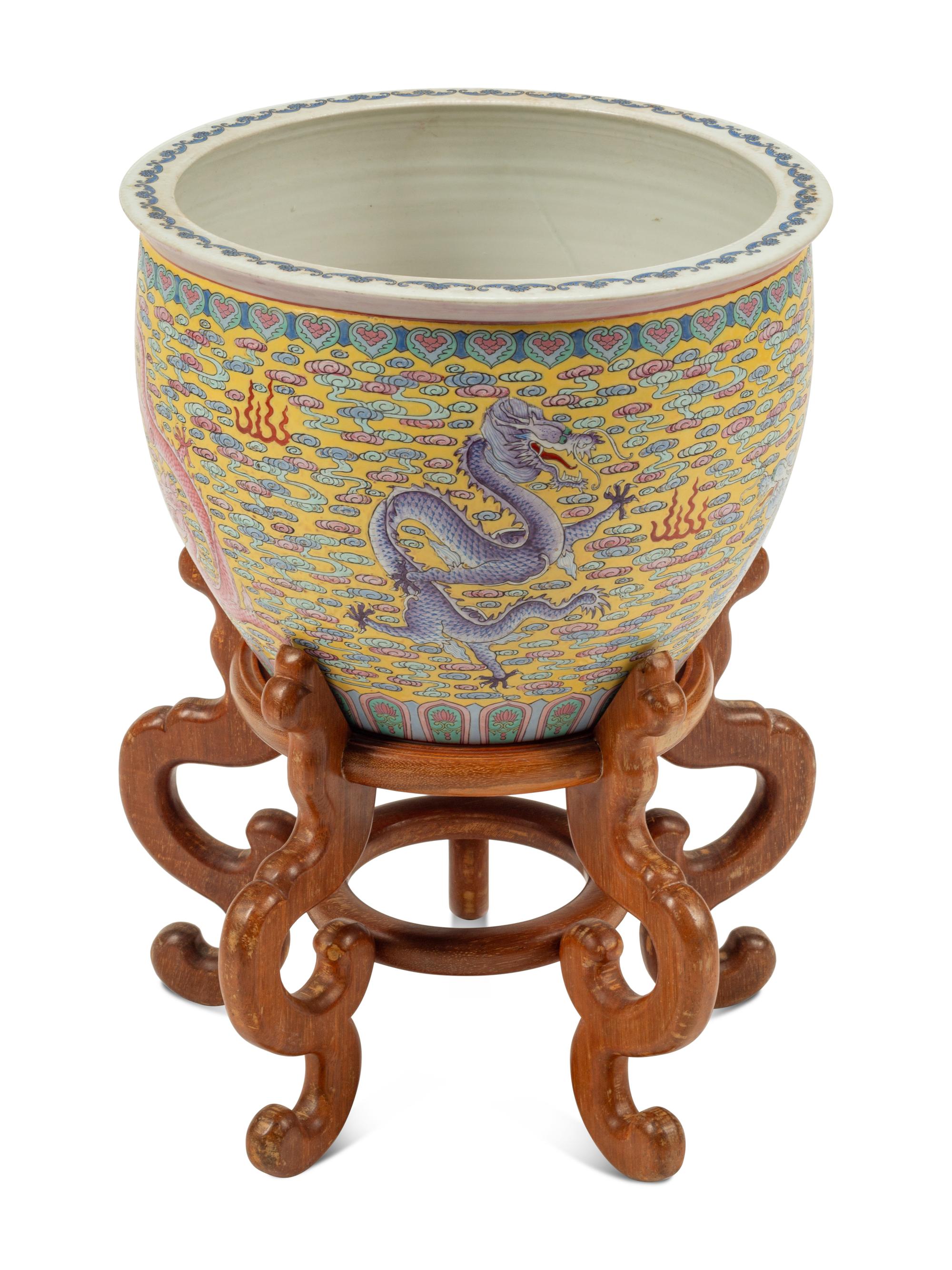 A Chinese Porcelain Jardinière on a Wood Stand