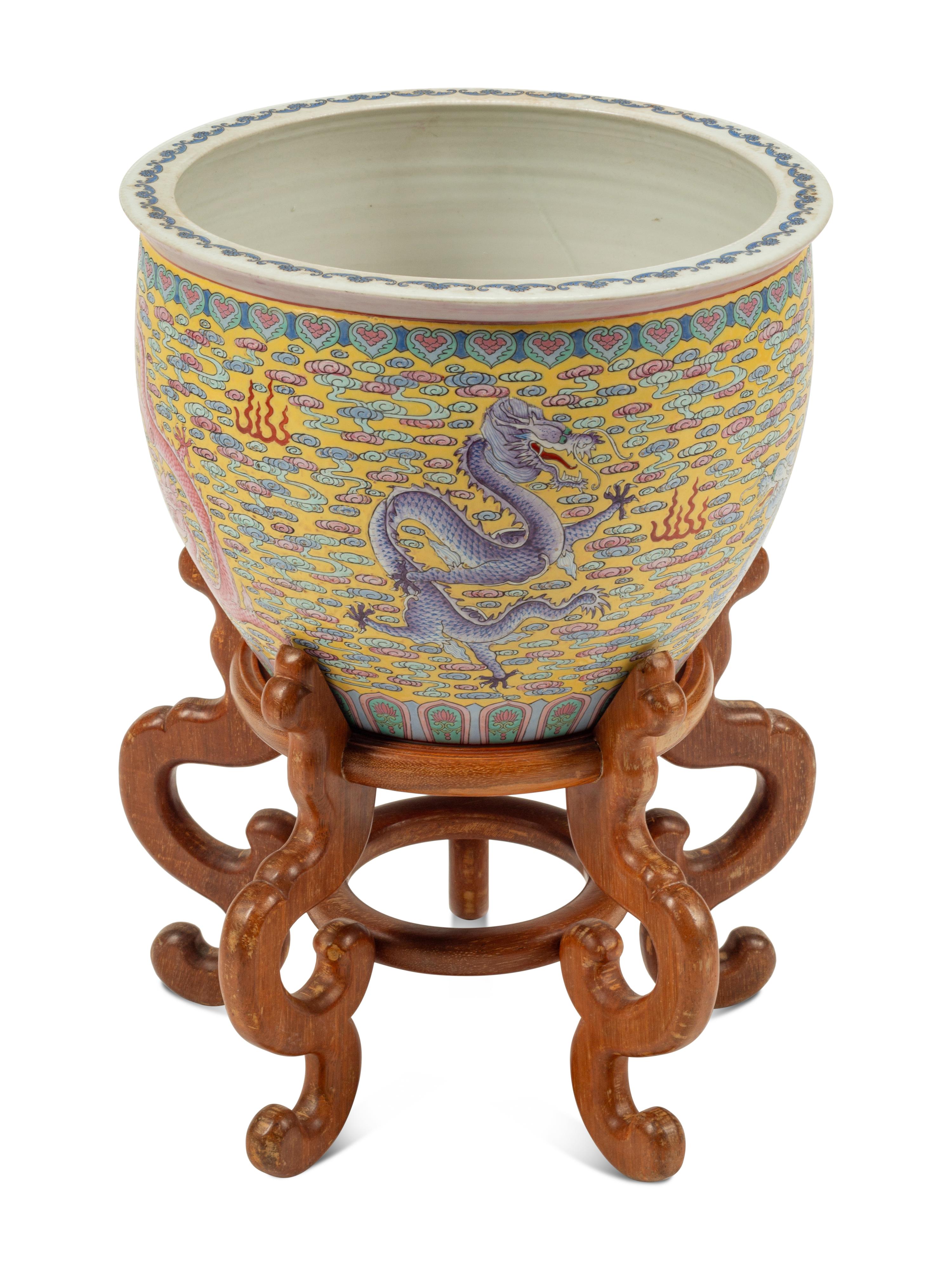 A Chinese Porcelain Jardinière on a Wood Stand