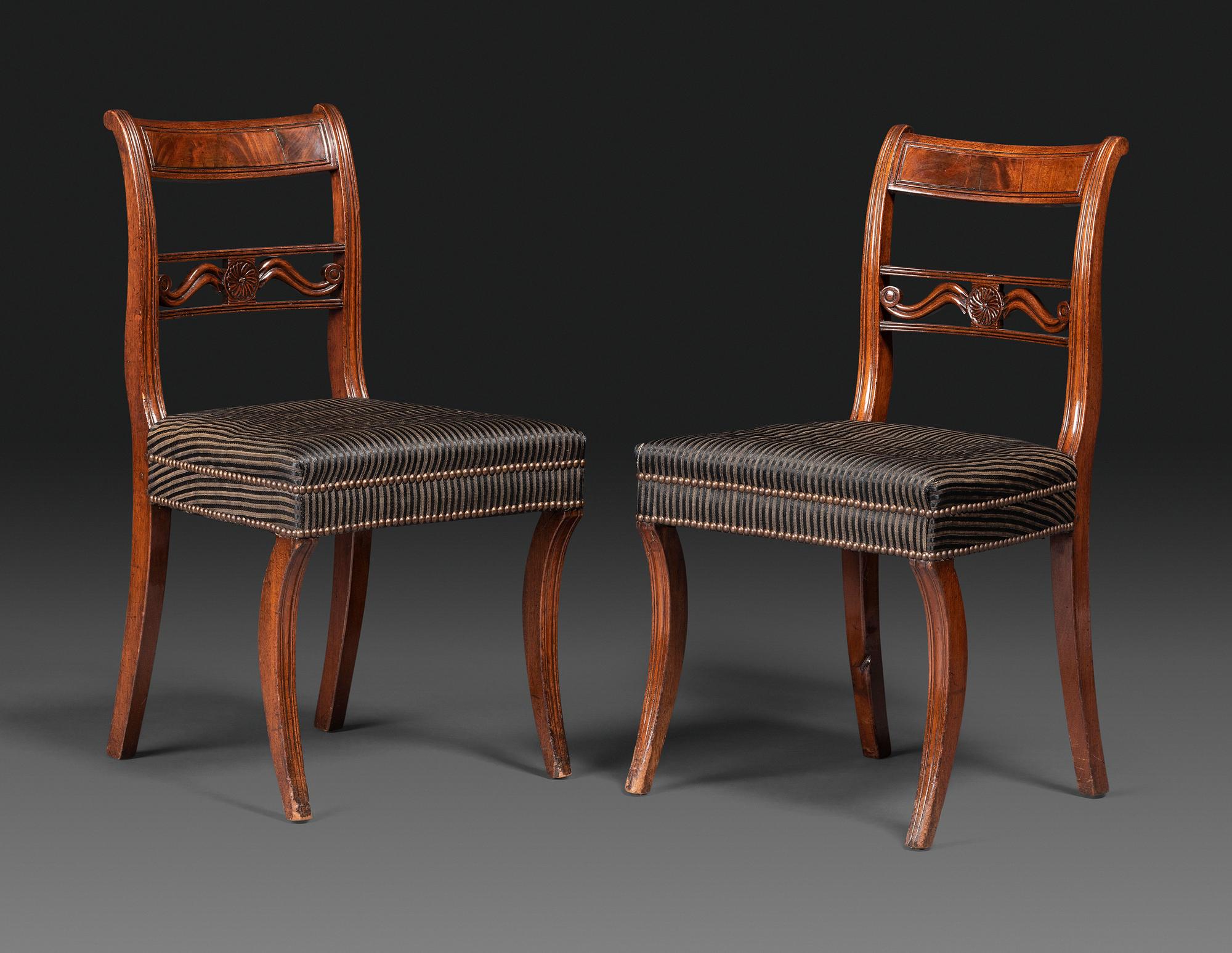 A Pair of Classical Carved and Figured Mahogany Klismos Side Chair