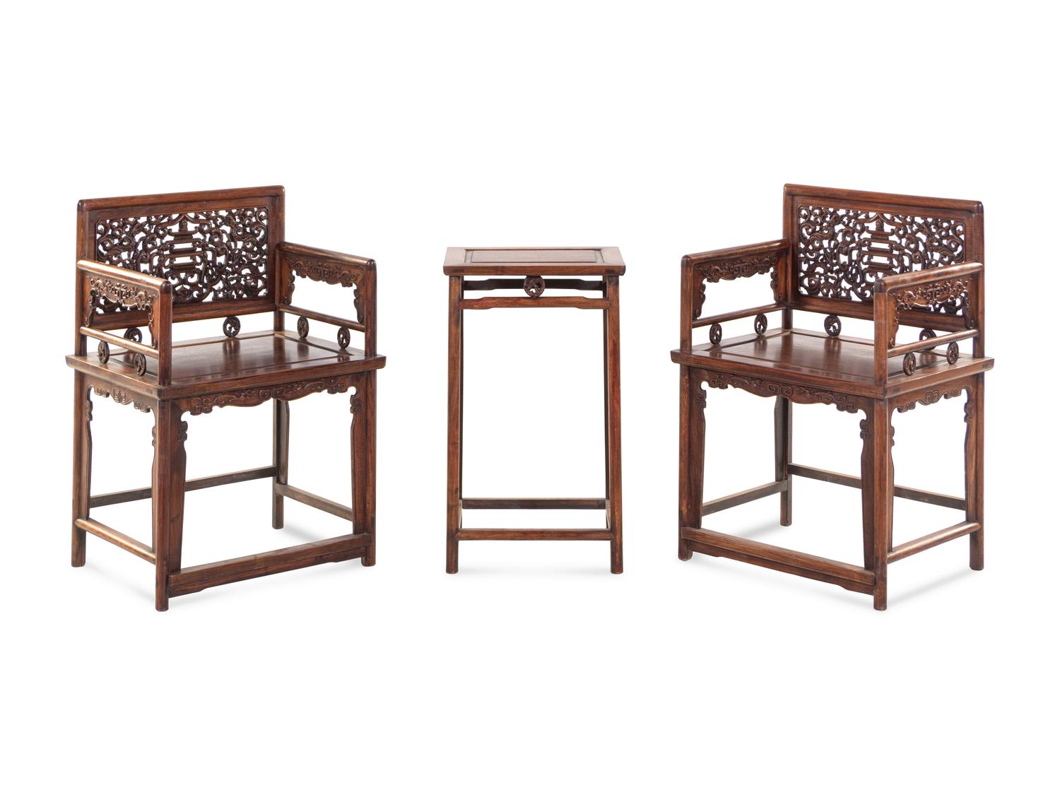 A Pair of Huali Low-Backed Armchairs and Matching Stand Table