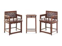 A Pair of Huali Low-Backed Armchairs and Matching Stand Table