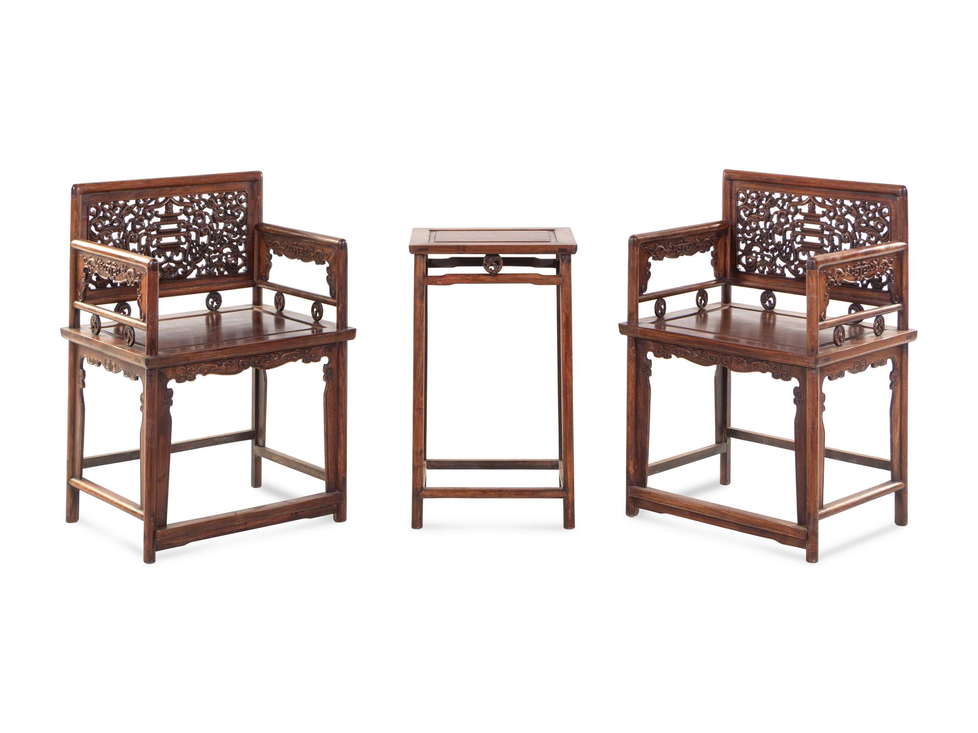 A Pair of Huali Low-Backed Armchairs and Matching Stand Table