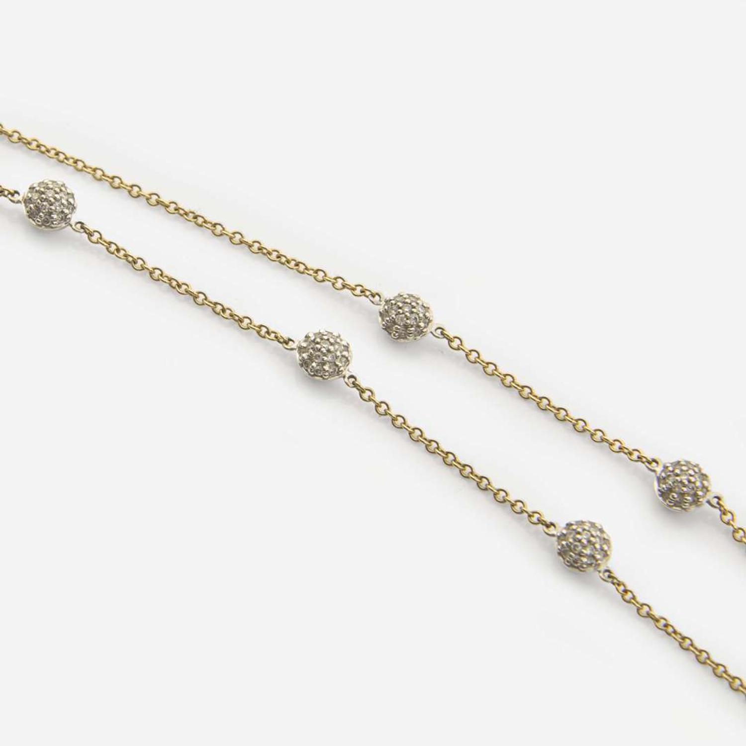 A Contemporary Gold and Diamond Ring and Necklace
