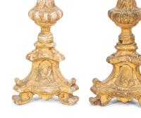 A Set of Four Italian Giltwood Candlesticks