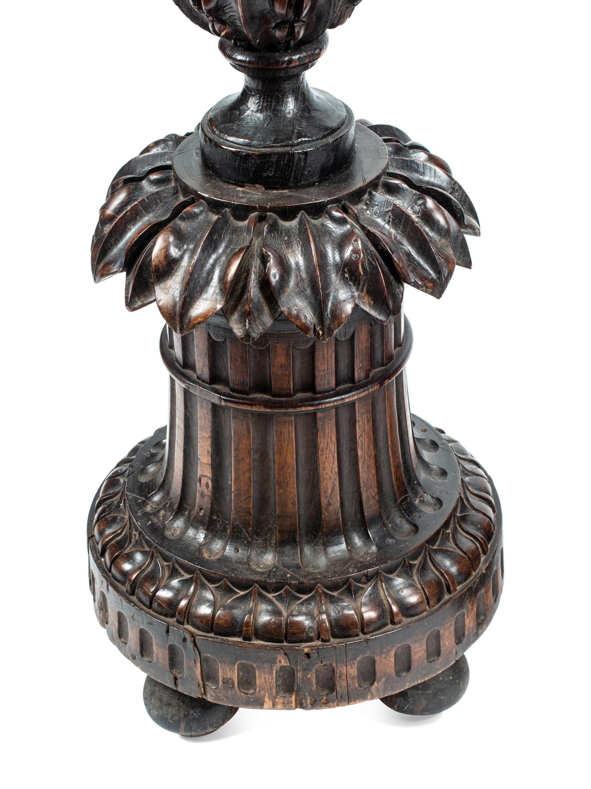 A Pair of Italian Carved Walnut Torchères