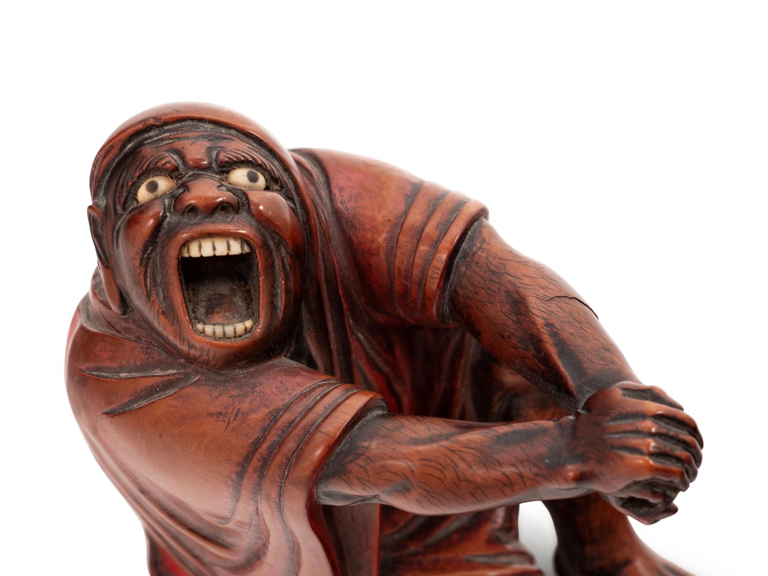 A Carved Wood Figure of Devil