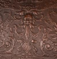 An Austrian Carved Walnut Bench with Tooled Leather Upholstery