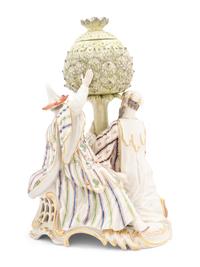 A Nymphenburg Porcelain Group of Figures with an Artichoke as a Perfume Burner