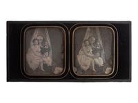 [EARLY PHOTOGRAPHY]. Stereodaguerreotype boudoir scene featuring two young women seated near a vanity.