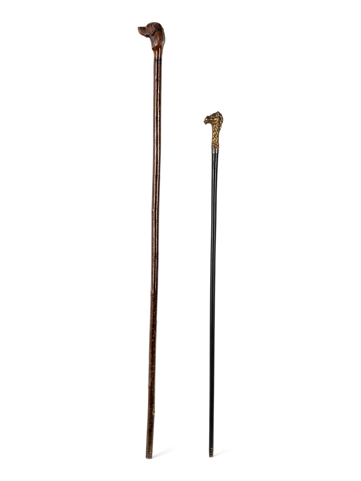 Two Figural Walking Sticks or Canes
