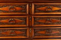 An Italian Baroque Style Walnut Chest of Drawers