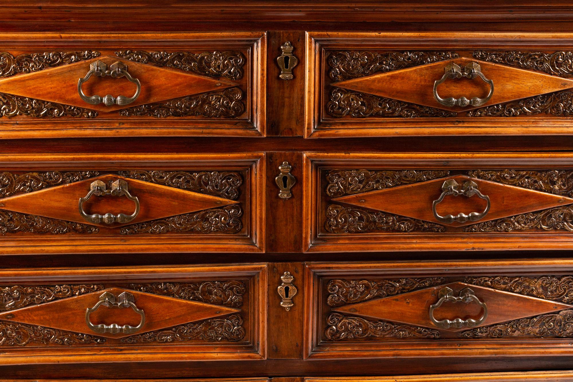 An Italian Baroque Style Walnut Chest of Drawers