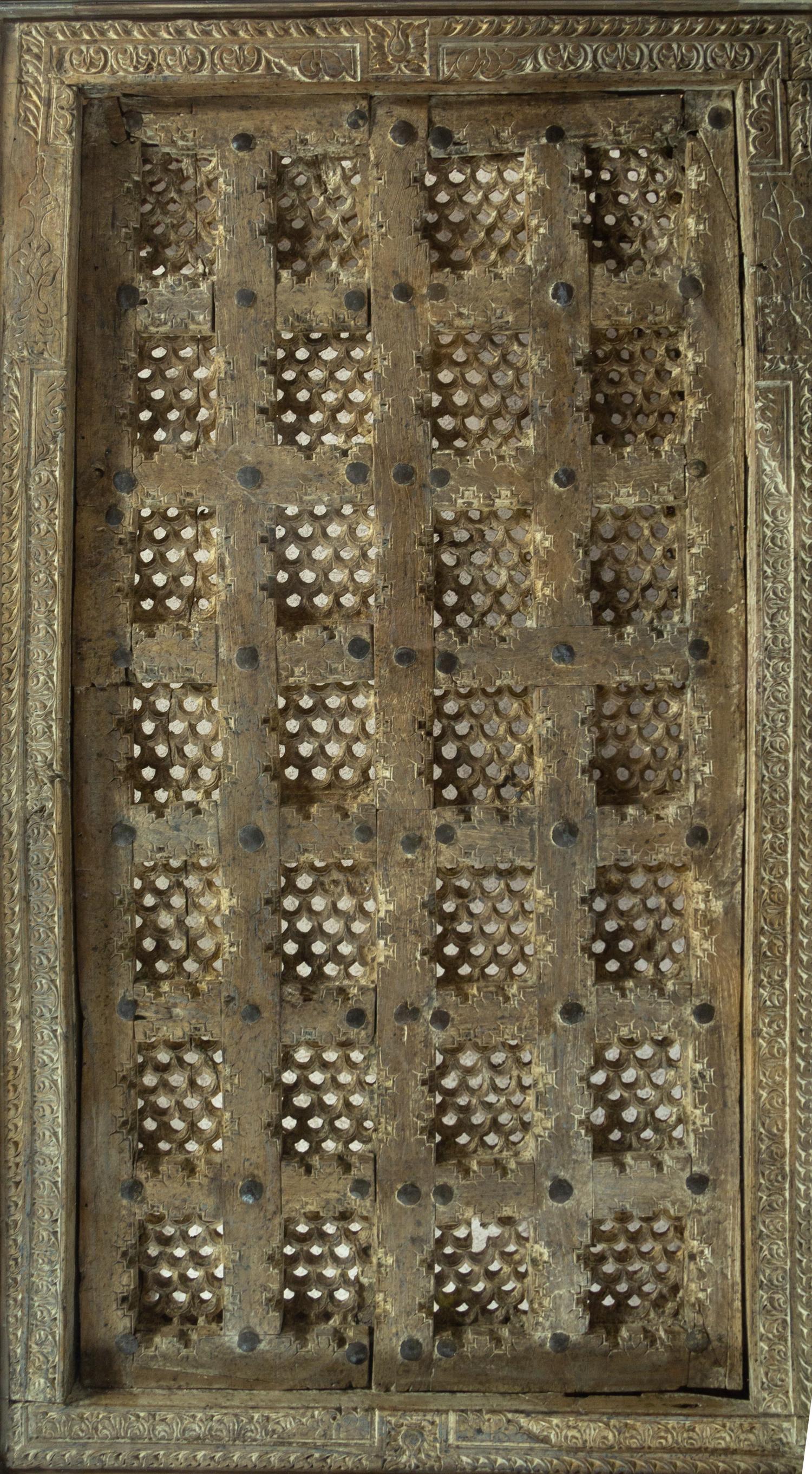 An Indian Iron Mounted Wood Door Converted to a Low Table