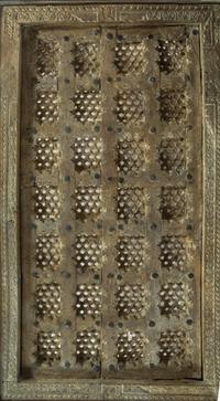 An Indian Iron Mounted Wood Door Converted to a Low Table