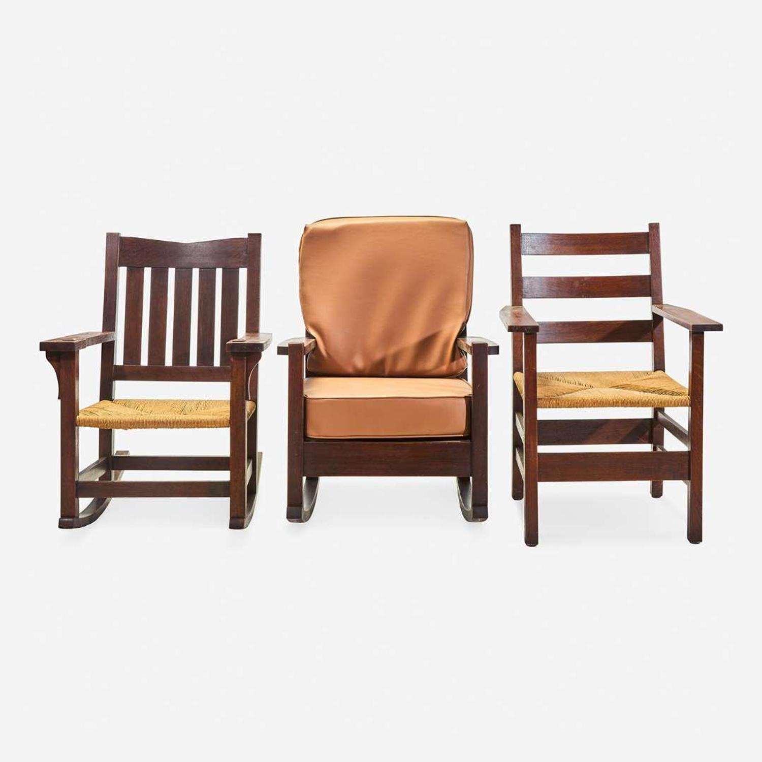 Gustav Stickley (American, 1858-1942) Three Chairs: Arm Rocker No. 2597, an Arm Rocker, and Armchair No. 2618-A, circa 1902