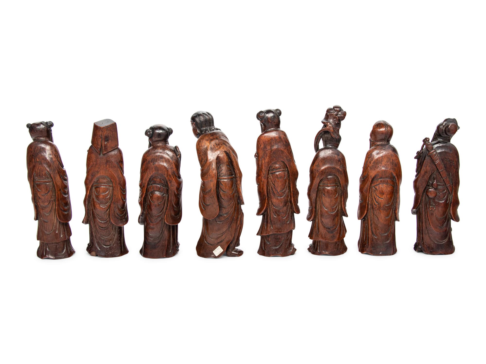 Eight Chinese Carved Hardwood Figures of the Daoist Immortals