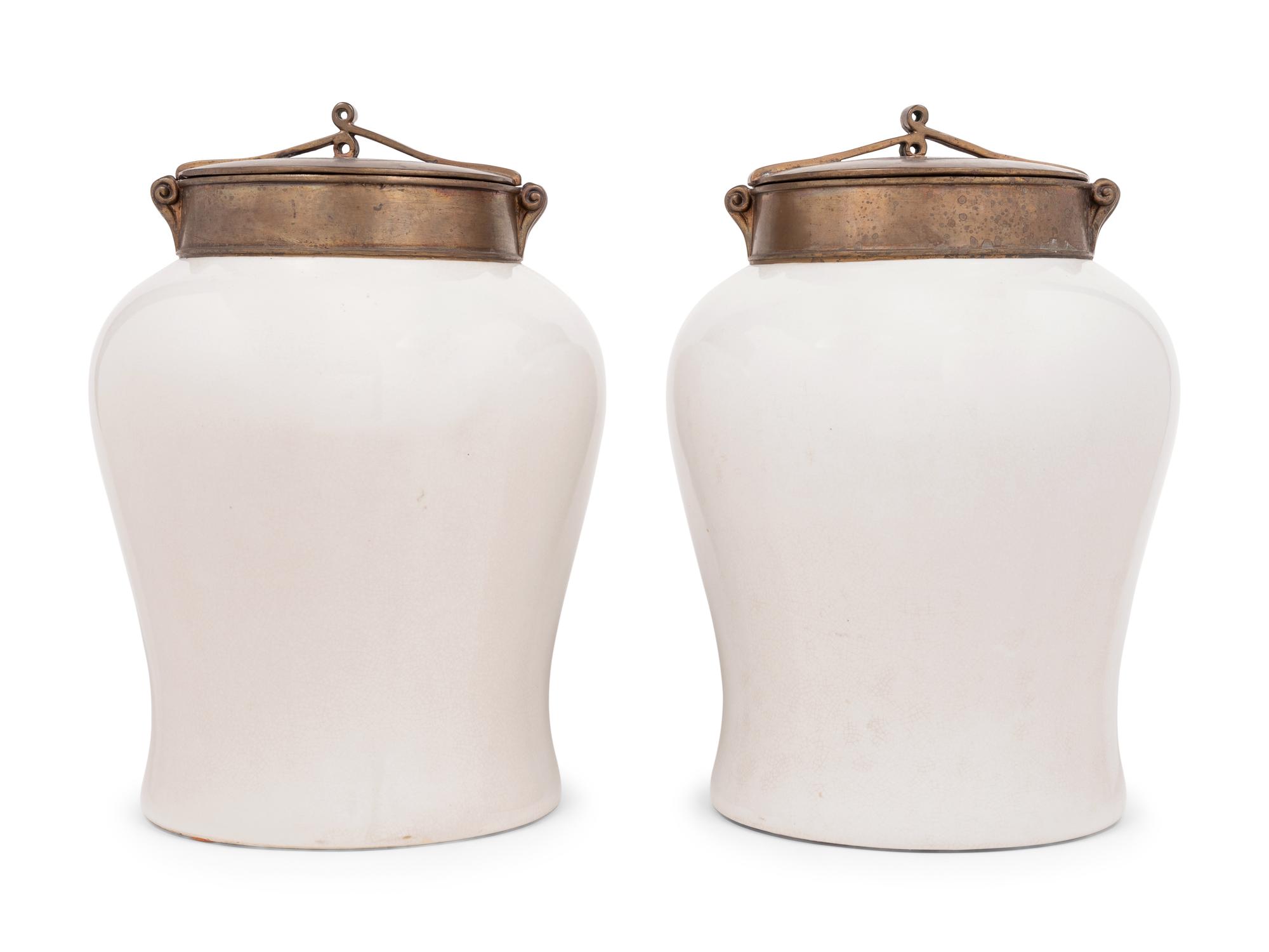 A Pair of Brass Mounted White Glazed Porcelain Jars