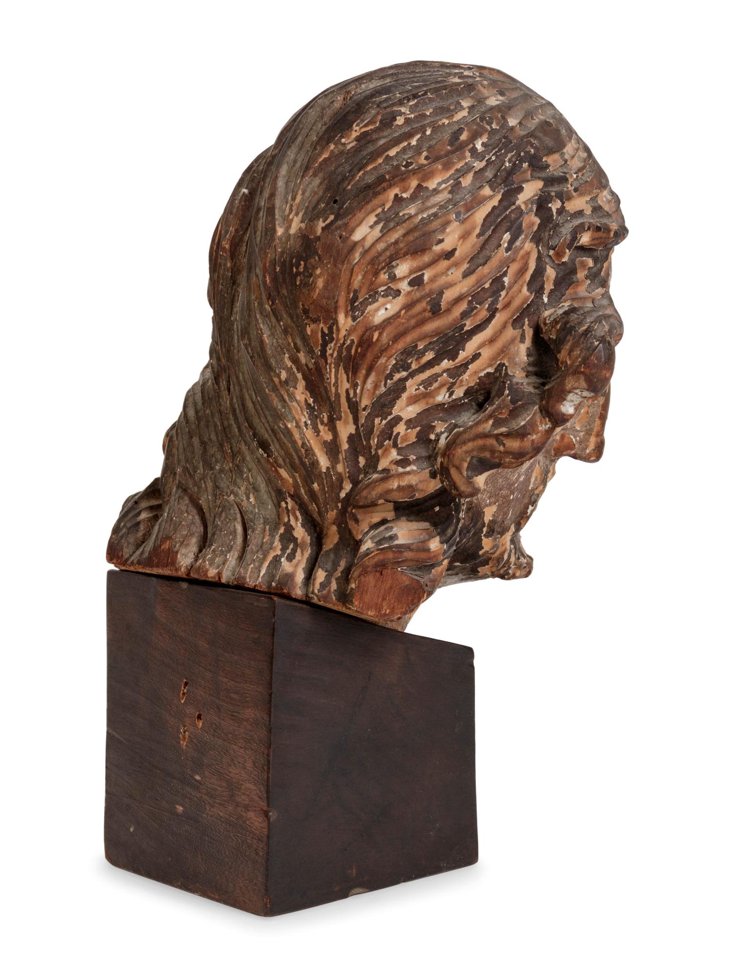 A Continental Carved and Polychromed Bust of a Saint