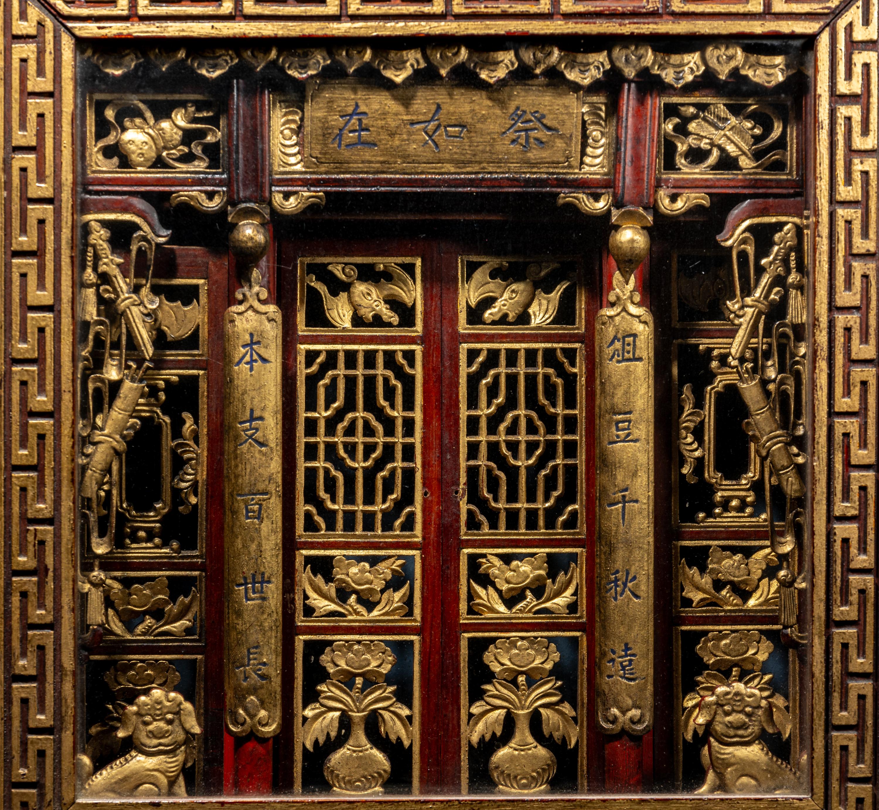 A Chinese Carved Gilt and Red Lacquered Wood Shrine