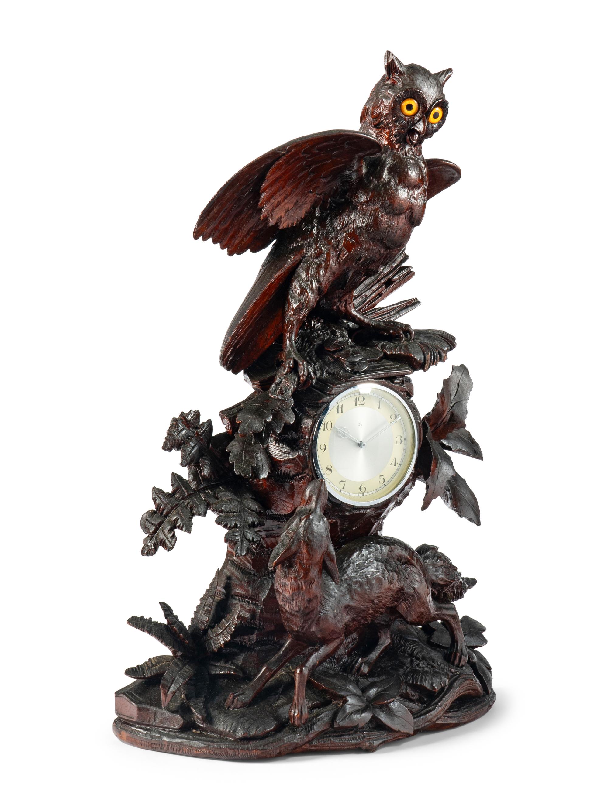 A Swiss "Black Forest" Carved Wood Clock