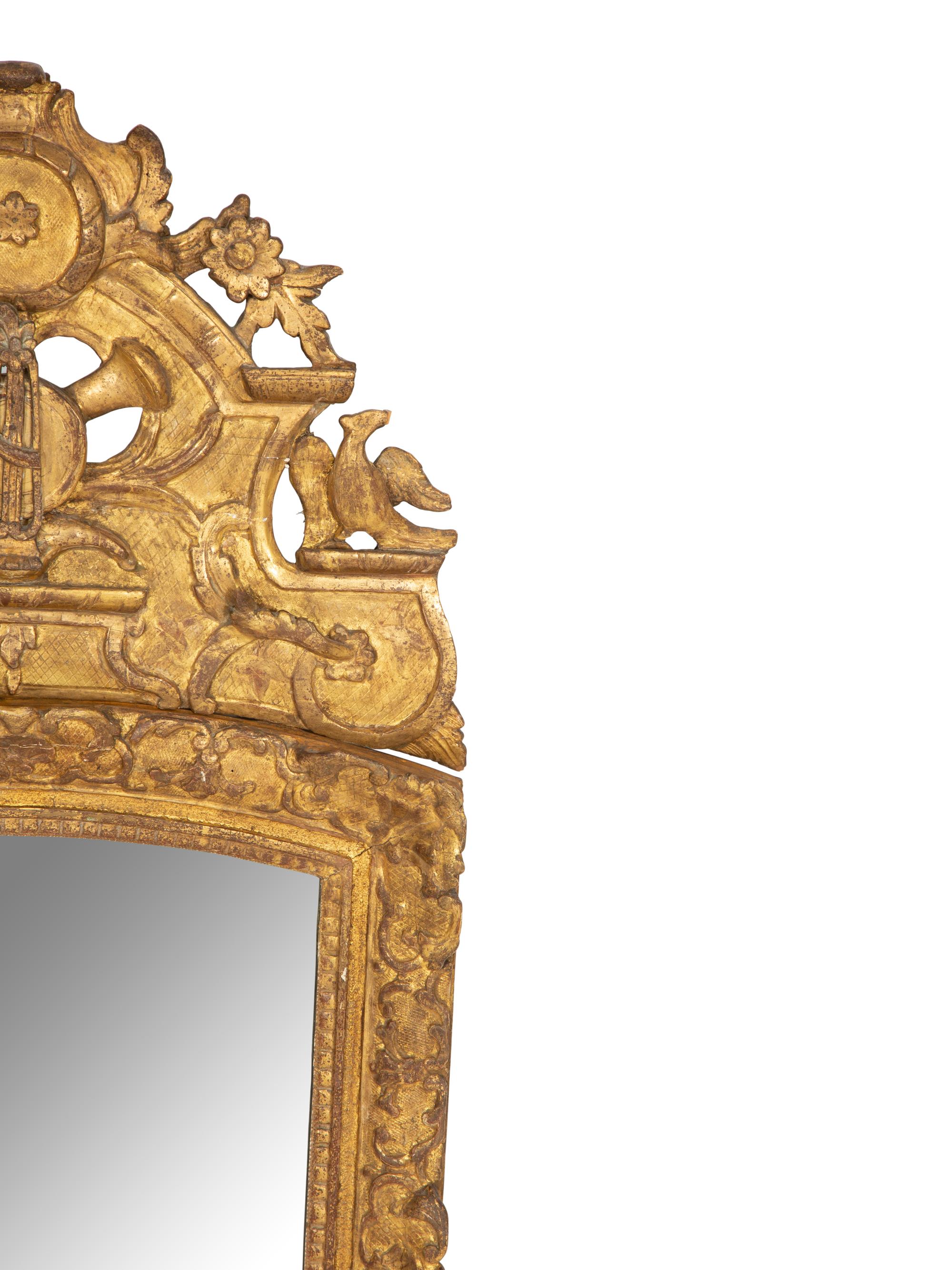 A Continental Carved Giltwood Wall Mirror