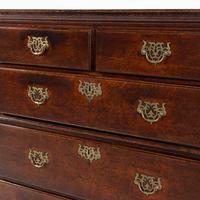 A George III Oak Two-Part Chest of Drawers